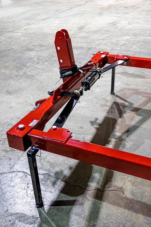 A top view of the 3 Point Round Hay Bale Unroller in Red